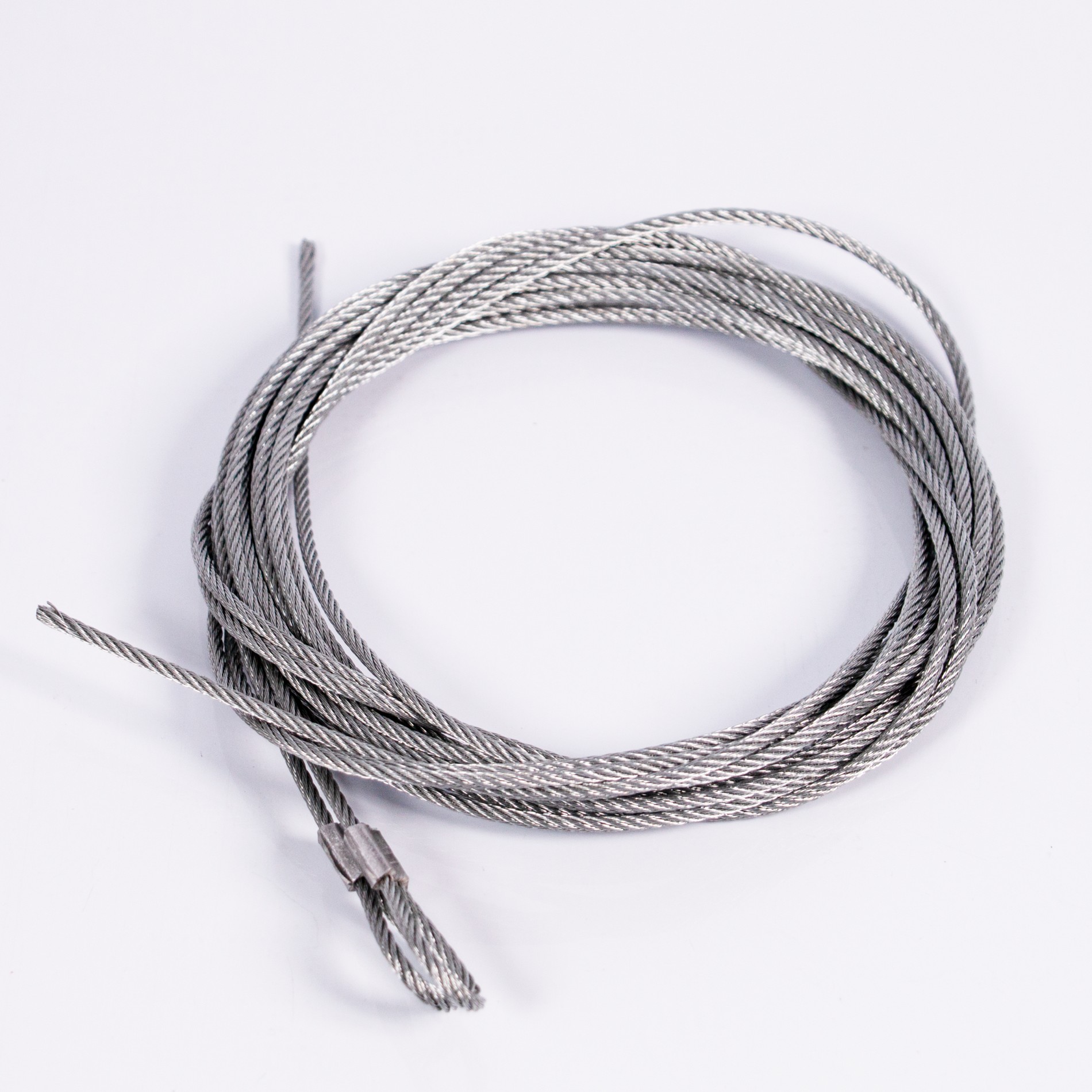 Close-up of coiled steel garage door lifting cable