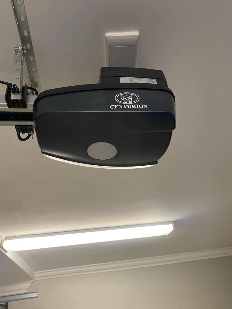 Centurion garage door motor installed on a garage ceiling