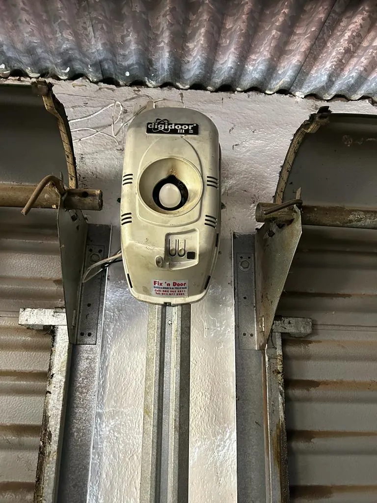 Digidoor opener above roll up garage door