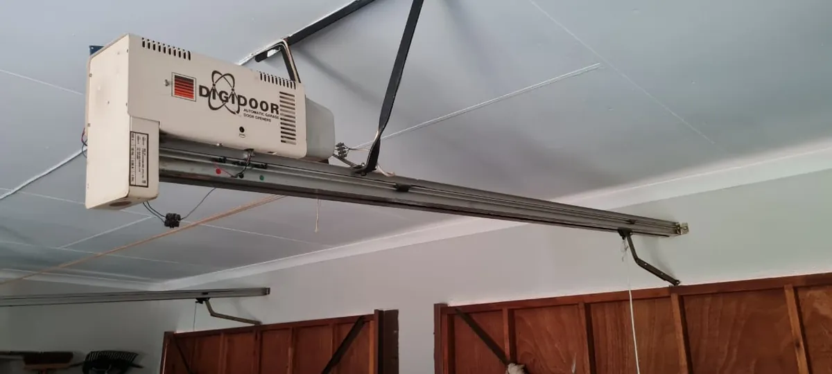 Garage door opener and overhead drive rail