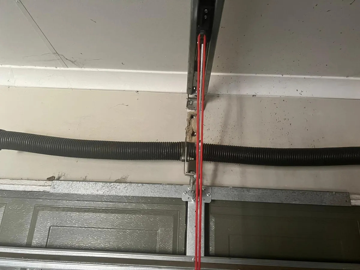 Garage door opener rail and red release cord