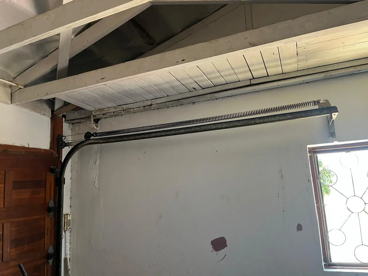 Garage door overhead track left side