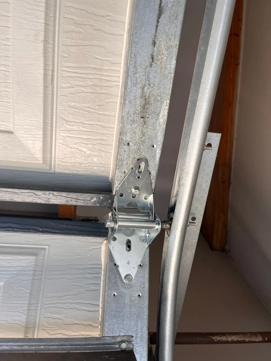 Sectional garage door hinge, roller and track hardware