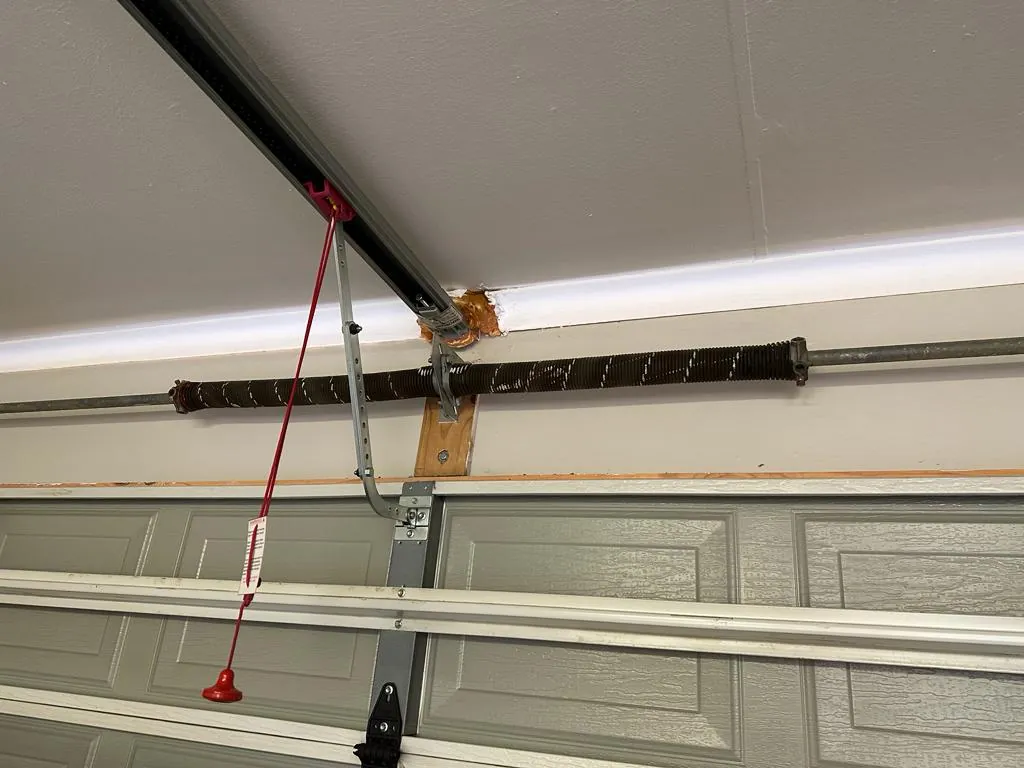 Steel garage door torsion spring and release cord