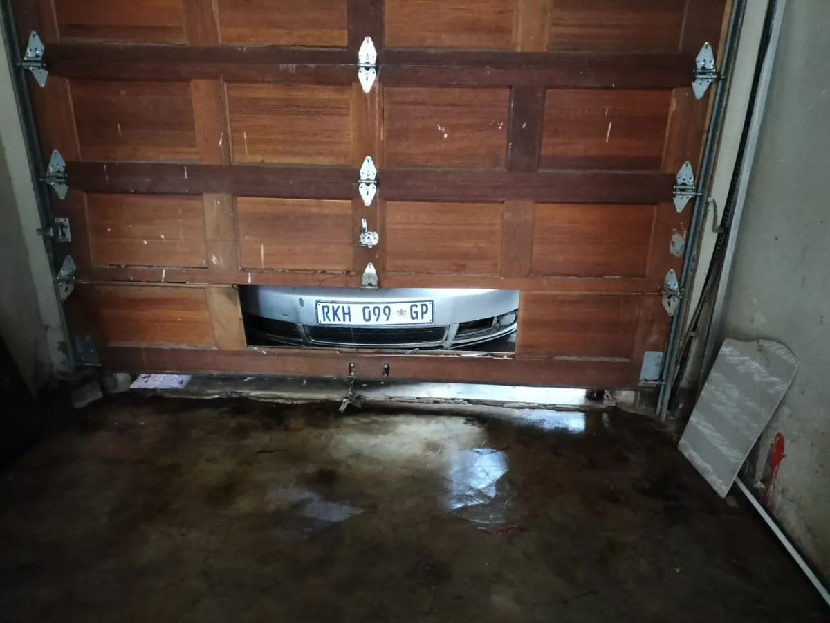 Damaged lower wooden garage door panel
