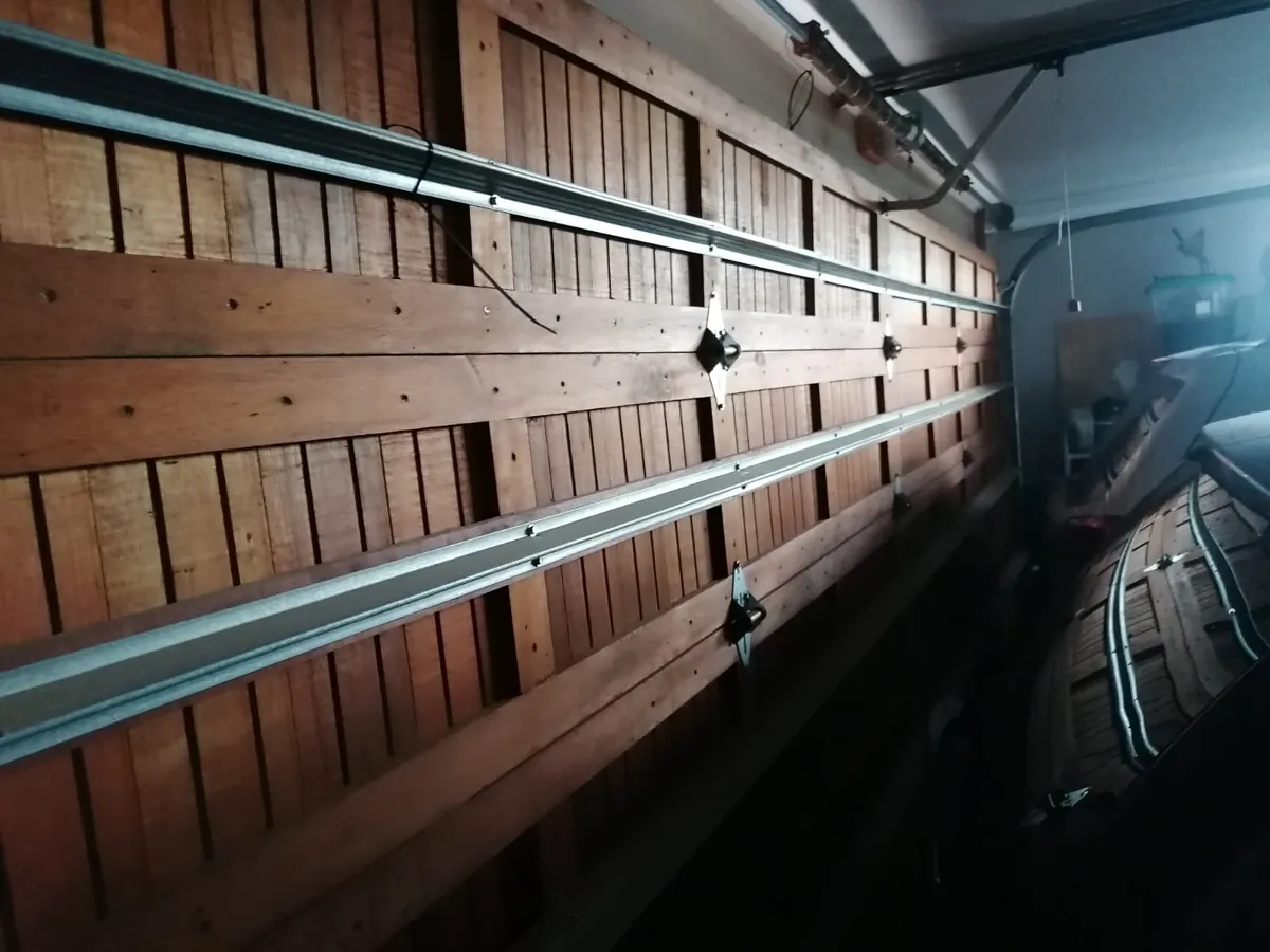 Wooden garage door reinforcement bars side view