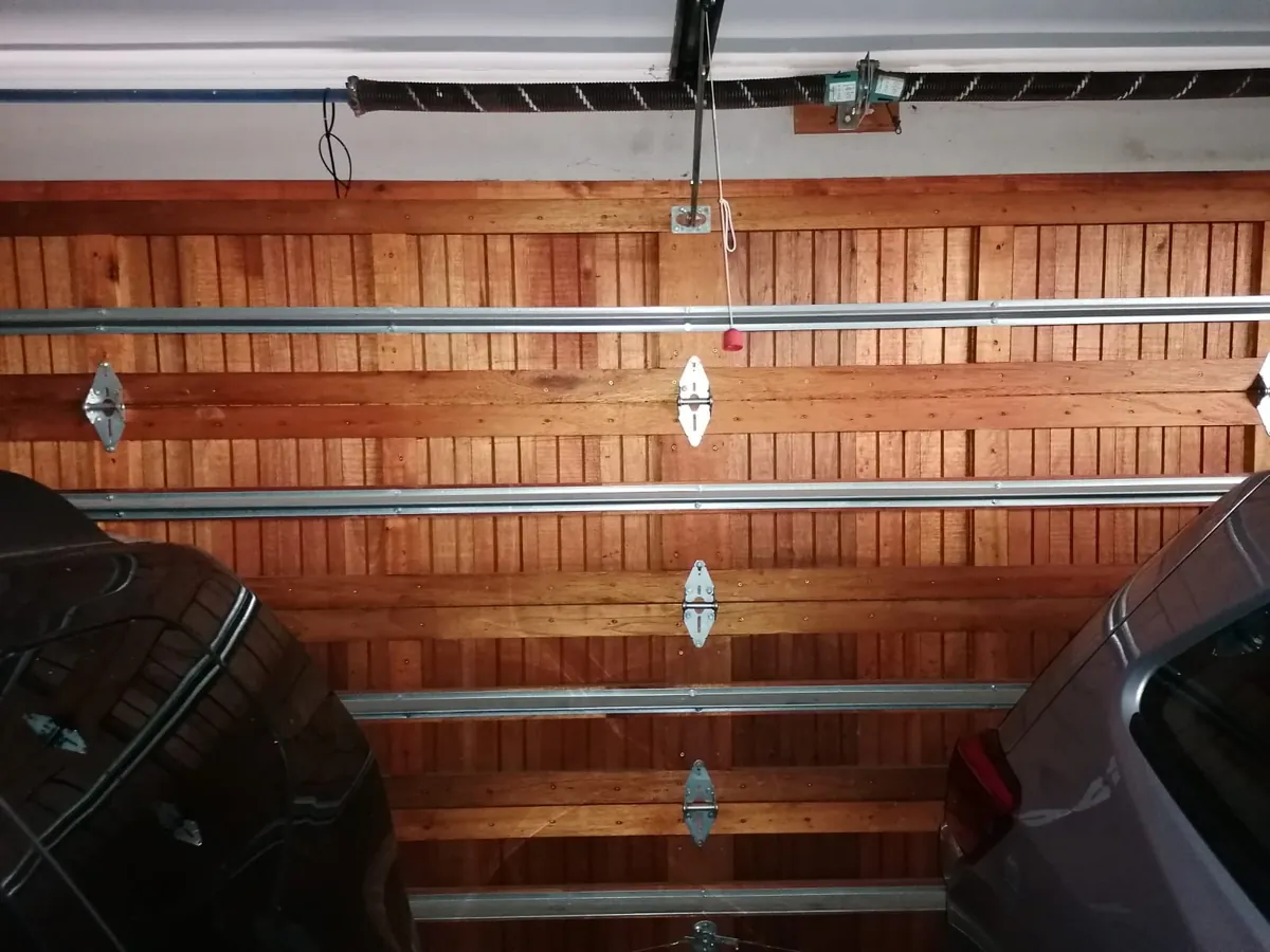 Wooden sectional garage door reinforcement bars
