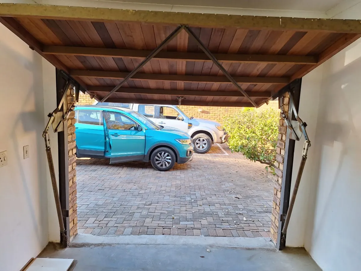 Wooden tip up garage door raised interior